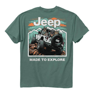 a teal green shirt with the jeep logo, an illustration of a jeep full of dogs off-roading, and the text “made to explore”
