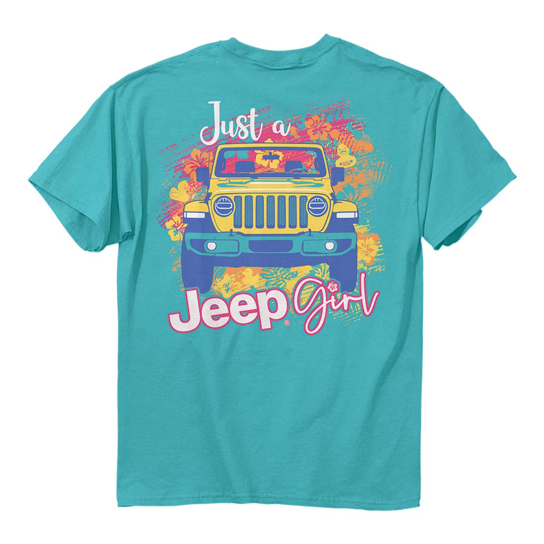 a teal shirt with an illustration of a yellow jeep surrounded by stylize images of tropical flowers with the words “just a jeep girl”