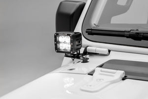 a pod light mounted on a white vehicle
