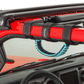Close-up red jeep vehicle with teal blue grab handle installed