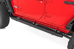 a red jeep with subtle steps installed by doors
