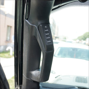 a 4 button panel installed in a vehicle’s grab handle