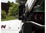 a white rubicon with a rounded rectangular mirror installed