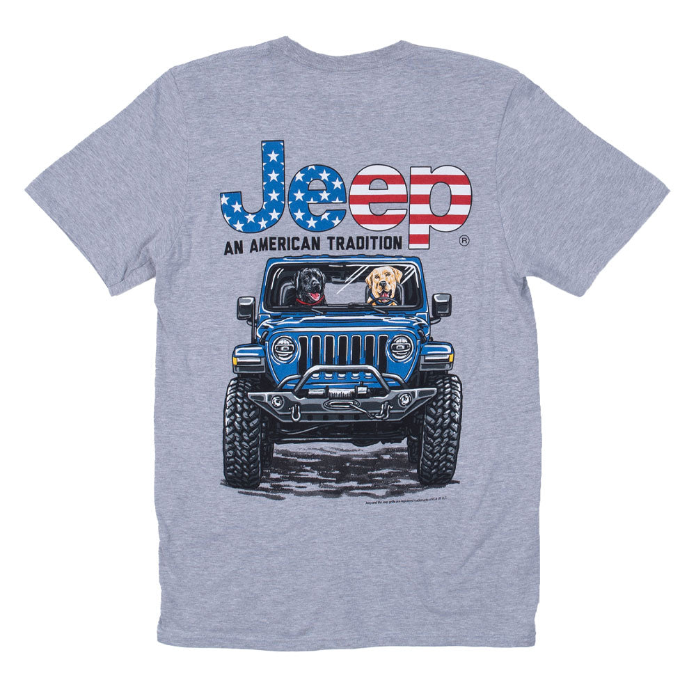 a grey shirt with two dogs driving a blue jeep and the words “jeep an american tradition” with usa flag flair