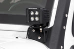 an led light is mounted to a white vehicle exterior