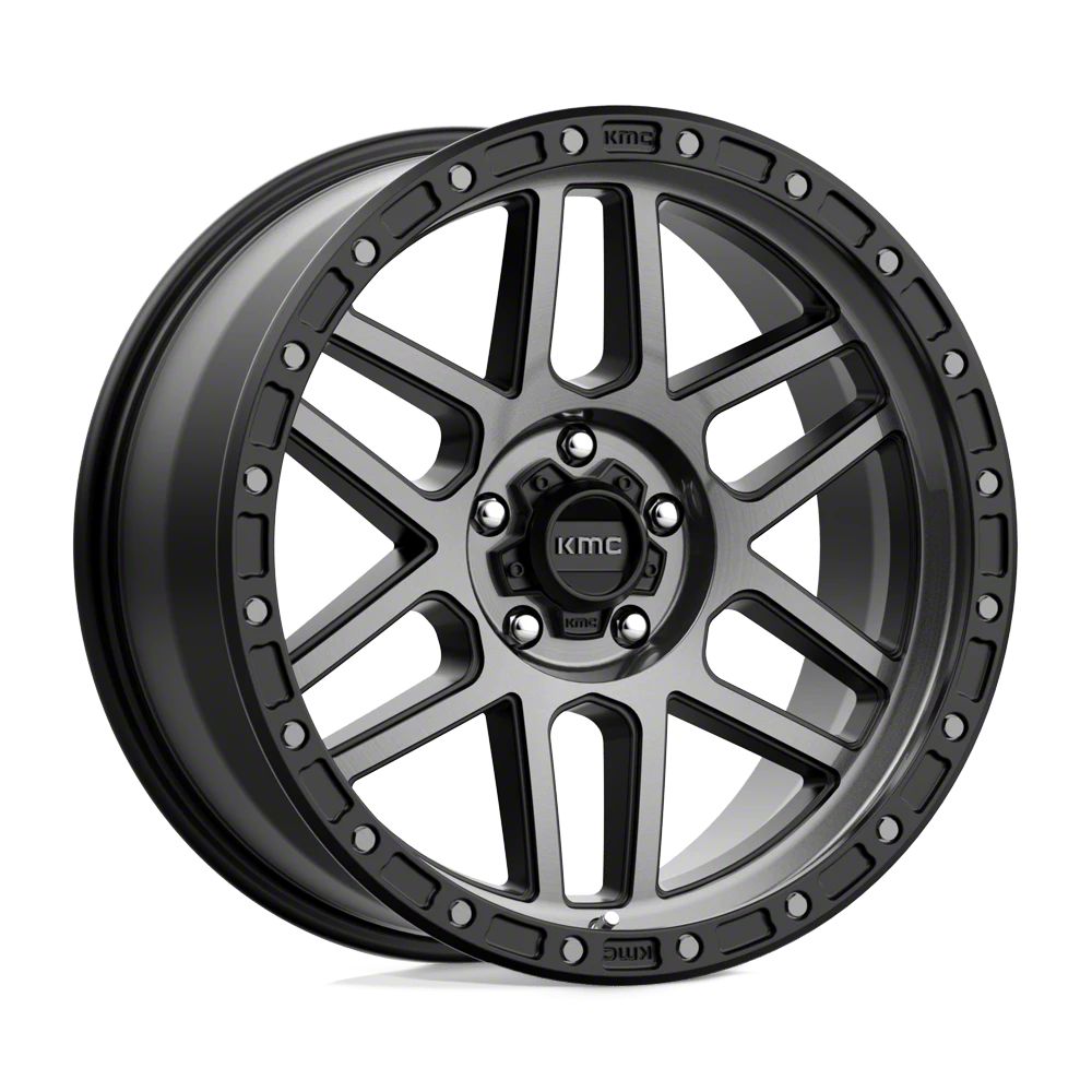 a black wheel with the KMC logo on it