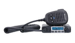 a midland handset rests on its radio on a white background
