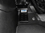 a MORE dead pedal sits installed in the floorboard of a jeep wrangler