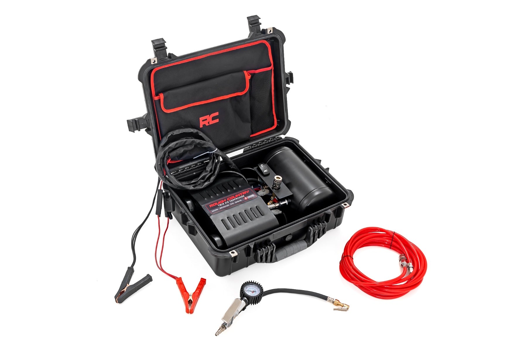 a black and red hard plastic case is open revealing air compressor and components