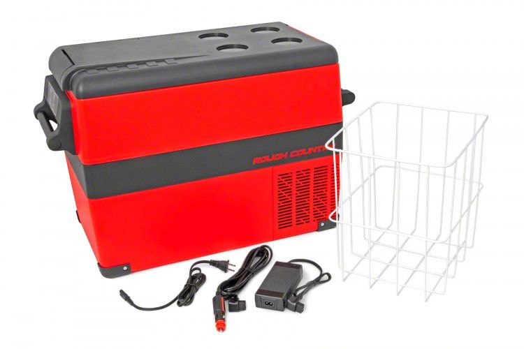a red cooler sits with a dividing cage and charging components