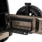the rear door of a bronze vehicle is open to reveal an installed tailgate table which has been opened