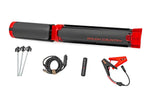 a folded red and black tripod displayed with its attachments