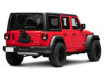 a red jeep wrangler is facing away revealing an installed wheel mount